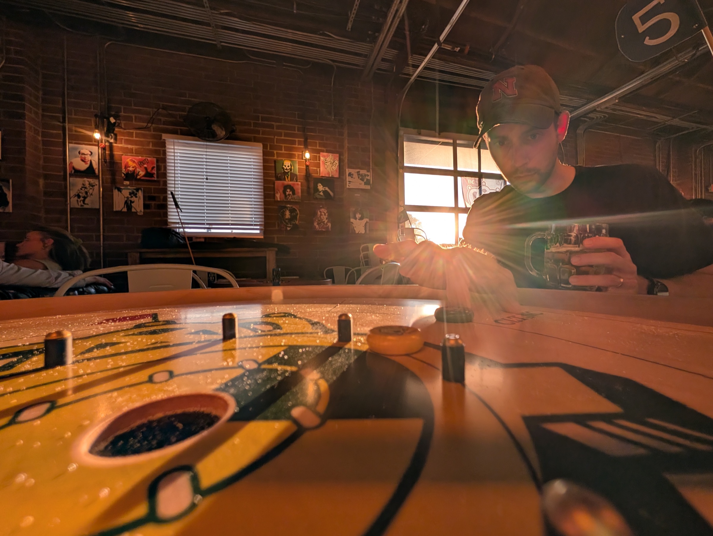 Crokinole board during a Queen City Crokinole club night